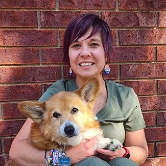 Dr. Elizabeth Brown at Animal Health Care Center Dr. Elizabeth Brown at Animal Health Care Center holding a corgi patient