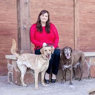 Dr. Cyndi Rachal at Animal Health Care Center Animal Health Care Center's Dr. Cyndi Rachal with two dogs