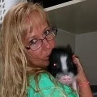 Animal Health Care Center Team Member Jazmine Lovell Animal Health Care Center's Jazmine Lovell with a pet pig